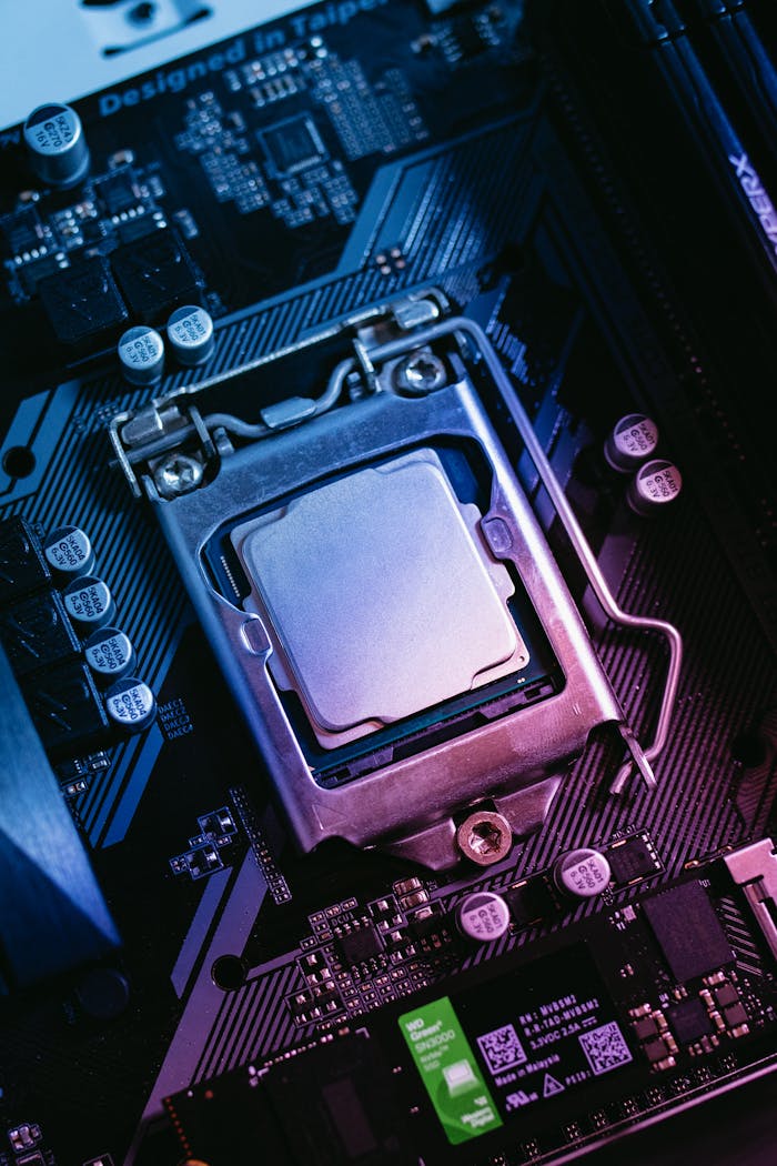 about-us Detailed close-up of a computer motherboard highlighting the CPU socket with electronic components.